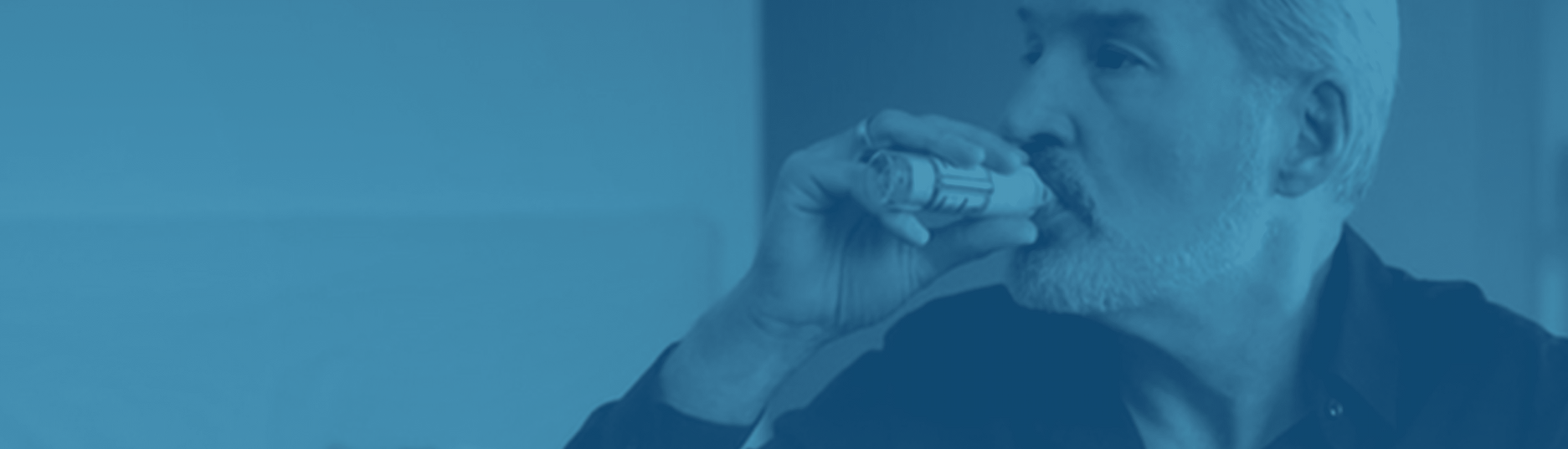 Man using respimat inhaler